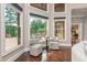 Bright breakfast nook with comfortable seating area and large windows with views of the outdoors at 3505 Watson Rd, Cumming, GA 30028