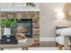Stone fireplace with a wood mantel, gas logs, and a glass screen in a neutrally decorated room at 3505 Watson Rd, Cumming, GA 30028