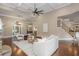 Open living room with high ceilings, fireplace, modern furnishings, and a staircase at 3505 Watson Rd, Cumming, GA 30028