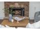 Close up of the stone fireplace in the living room with decorative accessories at 3505 Watson Rd, Cumming, GA 30028