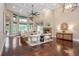 Spacious living room with coffered ceilings, stone fireplace, and large windows offering natural light at 3505 Watson Rd, Cumming, GA 30028