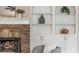 Close up of the living room fireplace surrounded by built-in shelving at 3505 Watson Rd, Cumming, GA 30028