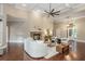 Open-concept living room with a fireplace, high ceilings, modern decor, and plenty of natural light at 3505 Watson Rd, Cumming, GA 30028