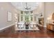 Open living space with hardwood floors, stone fireplace, and large windows at 3505 Watson Rd, Cumming, GA 30028