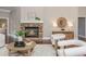 Cozy living room with stone fireplace, modern decor, and a light-filled atmosphere at 3505 Watson Rd, Cumming, GA 30028