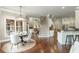 Open concept living space leading from the dining room, showing the staircase and kitchen features at 3505 Watson Rd, Cumming, GA 30028