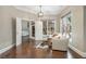 A sitting area in a bedroom with hardwood floors, comfortable chairs, and lots of natural light at 3505 Watson Rd, Cumming, GA 30028
