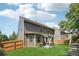 Backyard featuring a green lawn, wooden fence, playset, patio, and exterior of house at 6202 Oakdale Ridge Se Ct, Mableton, GA 30126