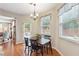 Cozy breakfast nook with hardwood flooring, natural light, and a view into the adjacent living room at 6202 Oakdale Ridge Se Ct, Mableton, GA 30126