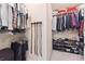 Well-organized walk-in closet with clothing racks, shelves, and storage space for shoes and accessories at 6202 Oakdale Ridge Se Ct, Mableton, GA 30126
