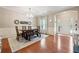 Elegant dining area showcasing hardwood floors, a rustic wood table set, and traditional style decor elements at 6202 Oakdale Ridge Se Ct, Mableton, GA 30126