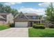 Charming two-story home with a brick and siding exterior, a two-car garage, and a well-manicured lawn at 6202 Oakdale Ridge Se Ct, Mableton, GA 30126
