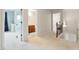 Upstairs hallway showcases entryways and a glimpse of a bathroom, highlighting the layout of the home at 6202 Oakdale Ridge Se Ct, Mableton, GA 30126