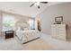 The spacious main bedroom has a vaulted ceiling, carpet, and an ensuite bathroom with storage space at 6202 Oakdale Ridge Se Ct, Mableton, GA 30126