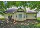 Backyard featuring vinyl siding, windows and patio at 876 Ashton Oak Cir, Stone Mountain, GA 30083