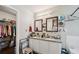 Bathroom features dual sinks, granite counters, and updated lighting at 876 Ashton Oak Cir, Stone Mountain, GA 30083