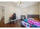 The bright bedroom has a modern bed frame and stylish flooring at 876 Ashton Oak Cir, Stone Mountain, GA 30083