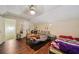 Bedroom with two beds, modern ceiling fan, and hardwood flooring at 876 Ashton Oak Cir, Stone Mountain, GA 30083