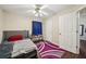 Comfortable bedroom with an interior door and carpet flooring at 876 Ashton Oak Cir, Stone Mountain, GA 30083