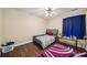The ample bedroom includes wood-look floors and a modern ceiling fan at 876 Ashton Oak Cir, Stone Mountain, GA 30083