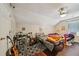 Bedroom with two beds, modern ceiling fan, and hardwood flooring at 876 Ashton Oak Cir, Stone Mountain, GA 30083