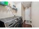 Laundry room features a modern washer and dryer, plus overhead storage at 876 Ashton Oak Cir, Stone Mountain, GA 30083