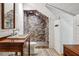 Bathroom with wood floors, neutral walls, brick shower and vintage looking furniture at 2121 Jep Wheeler Rd, Woodstock, GA 30188