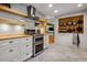 Well-lit kitchen featuring modern stainless steel appliances, white cabinetry and wooden countertops at 2121 Jep Wheeler Rd, Woodstock, GA 30188