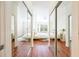Bedroom with hardwood floors, decorative rug, bedside table, and mirrored closet doors at 225 E Ponce De Leon Ave # 310, Decatur, GA 30030