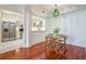 Dining area featuring hardwood floors, modern lighting, and a view into the kitchen at 225 E Ponce De Leon Ave # 310, Decatur, GA 30030