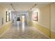 Bright hallway featuring diamond-pattern tile floors, track lighting, and modern artwork at 225 E Ponce De Leon Ave # 310, Decatur, GA 30030