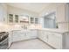 Bright kitchen featuring shaker cabinets, quartz countertops, gold hardware, and stainless steel appliances at 225 E Ponce De Leon Ave # 310, Decatur, GA 30030