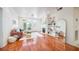 Bright living room with hardwood floors, fireplace, built-in shelves, and access to a balcony at 225 E Ponce De Leon Ave # 310, Decatur, GA 30030