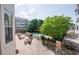 Community pool featuring lounge chairs, tables, a pergola, and lush landscaping at 225 E Ponce De Leon Ave # 310, Decatur, GA 30030