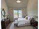 Cozy bedroom with natural light, classic furniture, and neutral colors at 2873 Shoals Hill Ct, Dacula, GA 30019