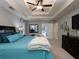 Cozy bedroom with tray ceiling, neutral colors, and ample natural light at 4673 Jefferson Township Pl, Marietta, GA 30066