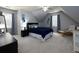 Bedroom with neutral colors, a black dresser, and two windows dressed with curtains allowing for ample natural light at 4673 Jefferson Township Pl, Marietta, GA 30066