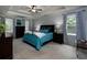 Comfortable bedroom with tray ceiling, neutral colors, and ample natural light at 4673 Jefferson Township Pl, Marietta, GA 30066