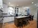 Open kitchen with island, granite countertops, stainless steel appliances, and hardwood flooring at 4673 Jefferson Township Pl, Marietta, GA 30066