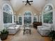 Bright living room with large windows, vaulted ceiling, and comfortable seating at 4673 Jefferson Township Pl, Marietta, GA 30066