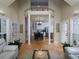 Open-concept living space with high ceilings, hardwood floors, and plenty of natural light at 4673 Jefferson Township Pl, Marietta, GA 30066
