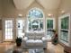 Cozy living area featuring hardwood floors, large windows, and access to the outdoor deck at 4673 Jefferson Township Pl, Marietta, GA 30066