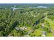 Aerial view of a neighborhood surrounded by trees near a lake at 4847 Lakewood Dr, Acworth, GA 30101