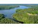 Scenic aerial of lake with lush trees and docks at 4847 Lakewood Dr, Acworth, GA 30101