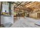 Unfinished basement with exposed ceiling joists, utilities, and concrete floor offers customization potential at 4847 Lakewood Dr, Acworth, GA 30101