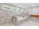 Bathroom featuring a tiled tub, shower and sleek design at 4847 Lakewood Dr, Acworth, GA 30101