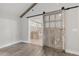 A pristine bathroom is accentuated by the sliding barn door at 4847 Lakewood Dr, Acworth, GA 30101