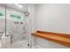 This bathroom is highlighted by a glass shower and built-in wooden shelves at 4847 Lakewood Dr, Acworth, GA 30101