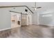 A lovely primary bedroom boasts a sliding barn door entry and hardwood floors at 4847 Lakewood Dr, Acworth, GA 30101