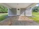 Attached carport with a paved driveway, exterior of home with simple landscaping at 4847 Lakewood Dr, Acworth, GA 30101